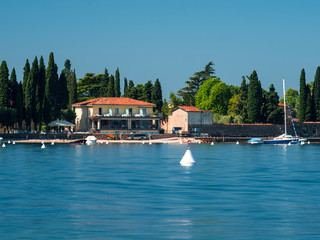 Fototapeta na wymiar Lake Gardasee Water view during Summer vacation time with a mediterranean feeling