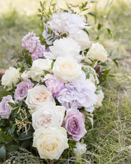 Beautiful wedding decoration ceremony. Modern bouquet of different flowers and green leaf.