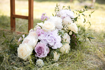 Beautiful element wedding decoration ceremony. Modern bouquet of different flowers and green leaf.