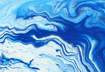 Obraz na płótnie Canvas photography of abstract marbleized effect background. Blue and white creative colors. Beautiful paint.