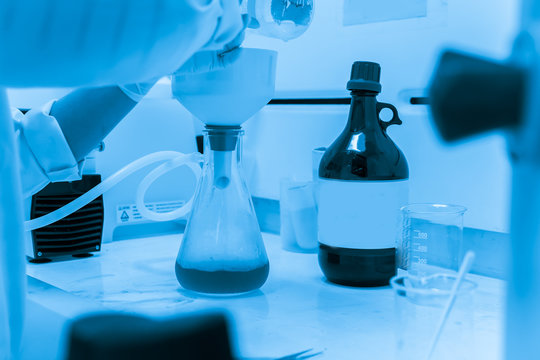 Asian scientist working in the lab,Experiment for customer,Using the formula, the physics and chemistry to calculate the value of the experiment,Thailand people