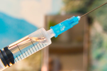 Syringe filled with medicine ready to use at close range.