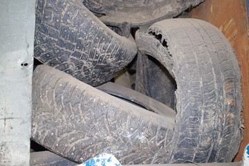 waste black tires in a container