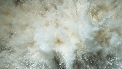 Explosion of white powder.