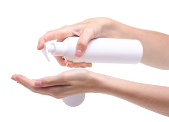 White bottle with dispenser beauty product in hand on white background isolation