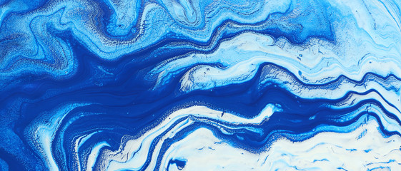 Obraz premium photography of abstract marbleized effect background. Blue and white creative colors. Beautiful paint. banner