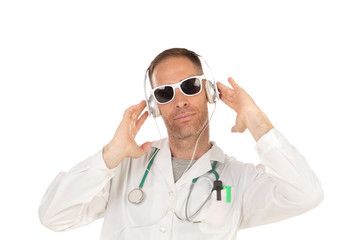 Handsome doctor with sunglasses listening music with headphones