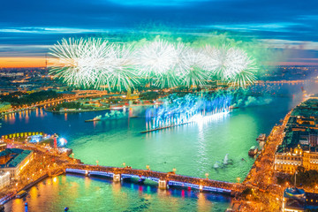 Grand fireworks over the waters of the Neva River in St. Petersburg, visible Palace Bridge, Peter and Paul Fortress.