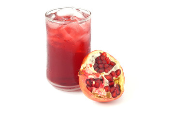 glass of juice and pomegranate isolated on white