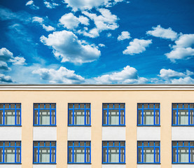 Exterior of the old office building under the blue sky.