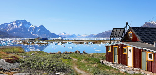 Abandoned fishing village, landscape Greenland, beautiful Nuuk fjord, ocean, iceberg with mountains background © dule964