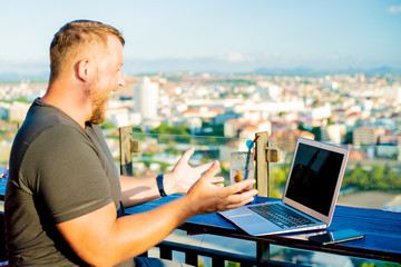 business man working problem using laptop looking at screen hold hands up, businessman sitting at the desk, isolated over white background, computer virus or error concept.