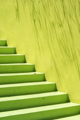 Green stone stairs and wall.