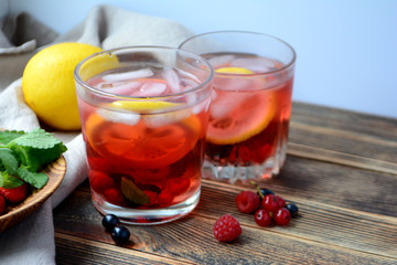 Cold berry lemonade in glasses Summer refreshing drink