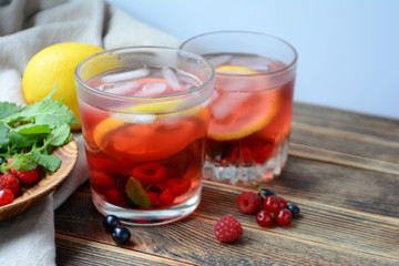 Cold berry lemonade in glasses Summer refreshing drink