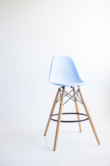 Blue wooden chairs for the legs on a white background. White cyclorama in the studio. Isolated.