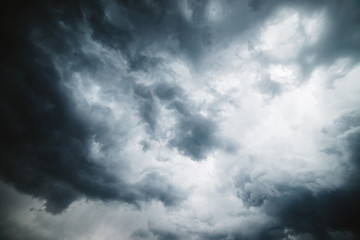 Dramatic cloudscape texture. Dark heavy thunderstorm clouds before rain. Overcast rainy bad weather. Storm warning. Natural gray background of cumulonimbus. Nature backdrop of stormy cloudy sky.
