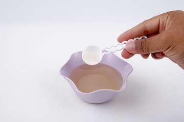 Brown sugar water in a bowl on white background