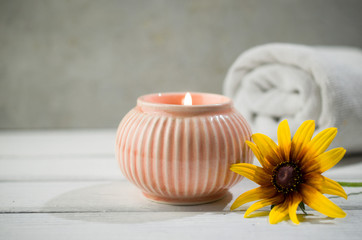 Aromatherapy candle with flowers, home spa, natural medicine