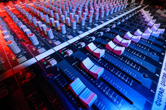 detail sound mixer in red and blue light with great perspective