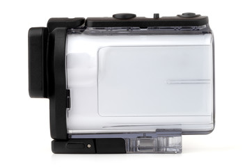 Portable video camera on a white background. An action camera in a protective case close-up.