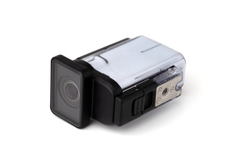 Portable video camera on a white background. An action camera in a protective case close-up.