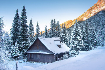 Winter. Christmas background. Frosty mountain landscape. Beautiful winter scene with wooden house in Tatra mountains