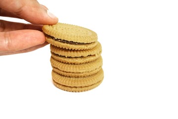 Cookies filled with chocolate cream on a white background