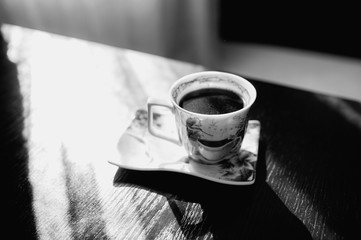 the bride is drinking coffee, bride holds a cup of coffee, bride in a white coat, morning of the...