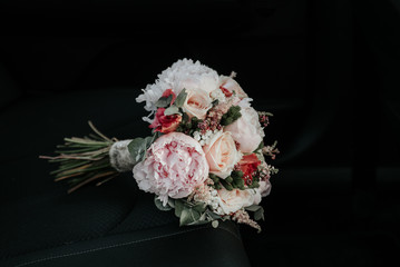 bridal bouquet in a car seat