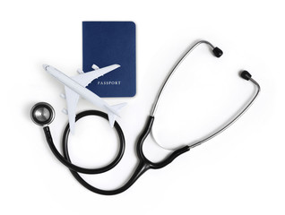 international medical travel insurance concept, stethoscope, passport and airplane isolated on...