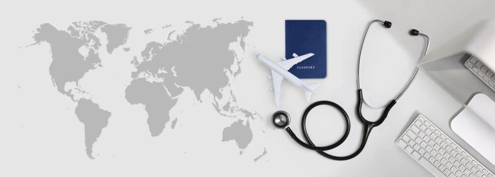 International Medical Travel Insurance Concept, Stethoscope, Passport, Computer And Airplane On Desk Office Banner With Global Map