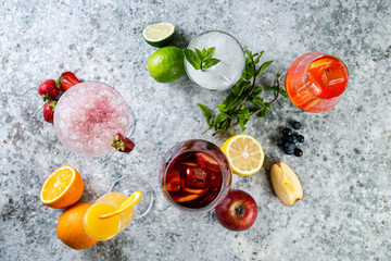 Selection of refreshing summer drinks - mojito, sangria, mimosa, aperol, martini, rustic background...