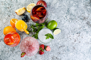 Selection of refreshing summer drinks - mojito, sangria, mimosa, aperol, martini, rustic background copy space