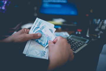 woman hands counting turkish lira