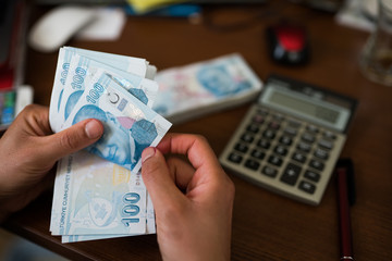 woman hands counting turkish lira