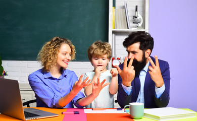 Kid with family learning numbers. Math for kids. Child from elementary school. Teachers day. First day at school. Happy family.