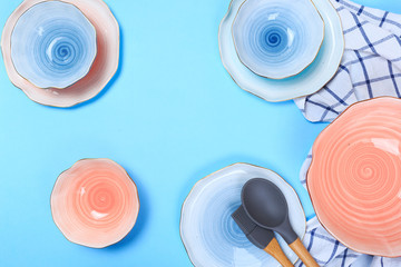 Simple rustic handmade Ceramic tableware on blue background