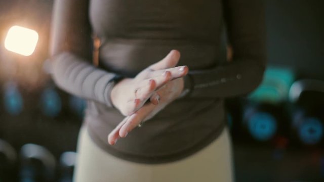 Lady In Brown Pullover And White Leggings Hands With Golden Ring Clap Making Chalk Cloud Extreme Close View Slow Motion