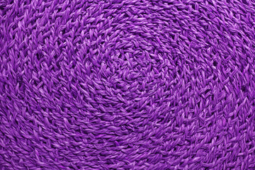 Spiral texture of vivid purple color woven water hyacinth place mat for background or wallpaper