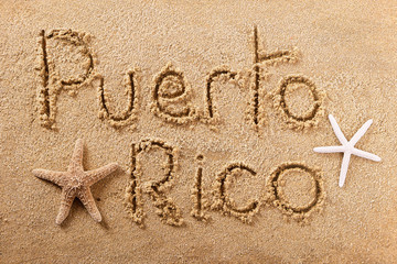 Fototapeta na wymiar Puerto Rico word written in sand on a sunny summer beach with starfish holiday vacation travel destination sign writing message photo