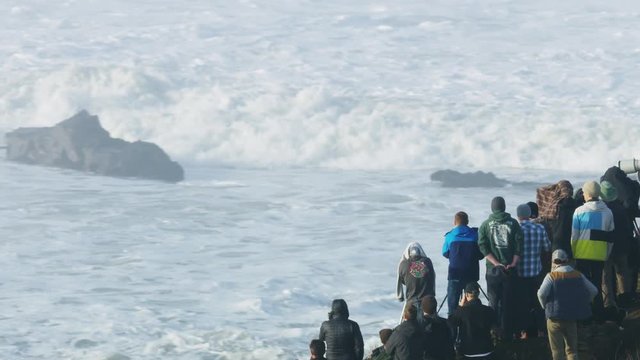 Aerial people watching big waves surfing Mavericks USA 