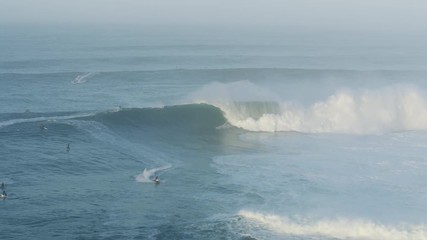 Aerial surfers on extreme surf competition Mavericks USA