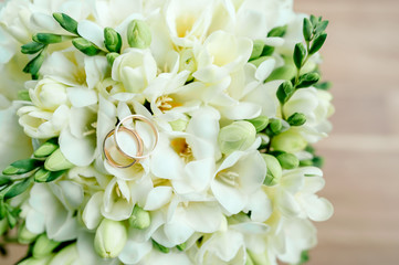 bride in a white dress with a luxurious bouquet decorated with eucalyptus
