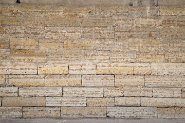 Textural background, brickwork from sandstone bricks.