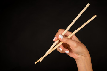 Hand with chopsticks