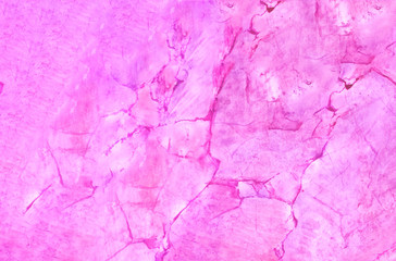 Marble background of bright yellow color, natural light, copy space, closeup.