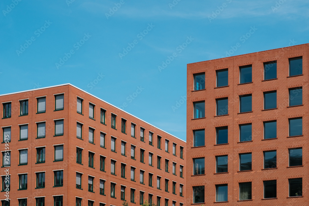 Poster red brick building blocks and blue sky - real estate concept