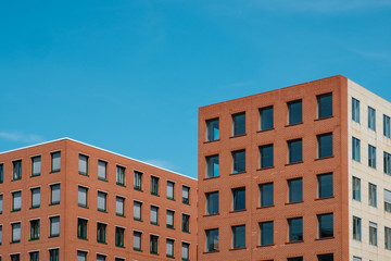  real estate exterior, modern building facade and blue sky