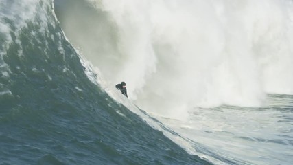 Aerial view surfer on tube wave Mavericks USA